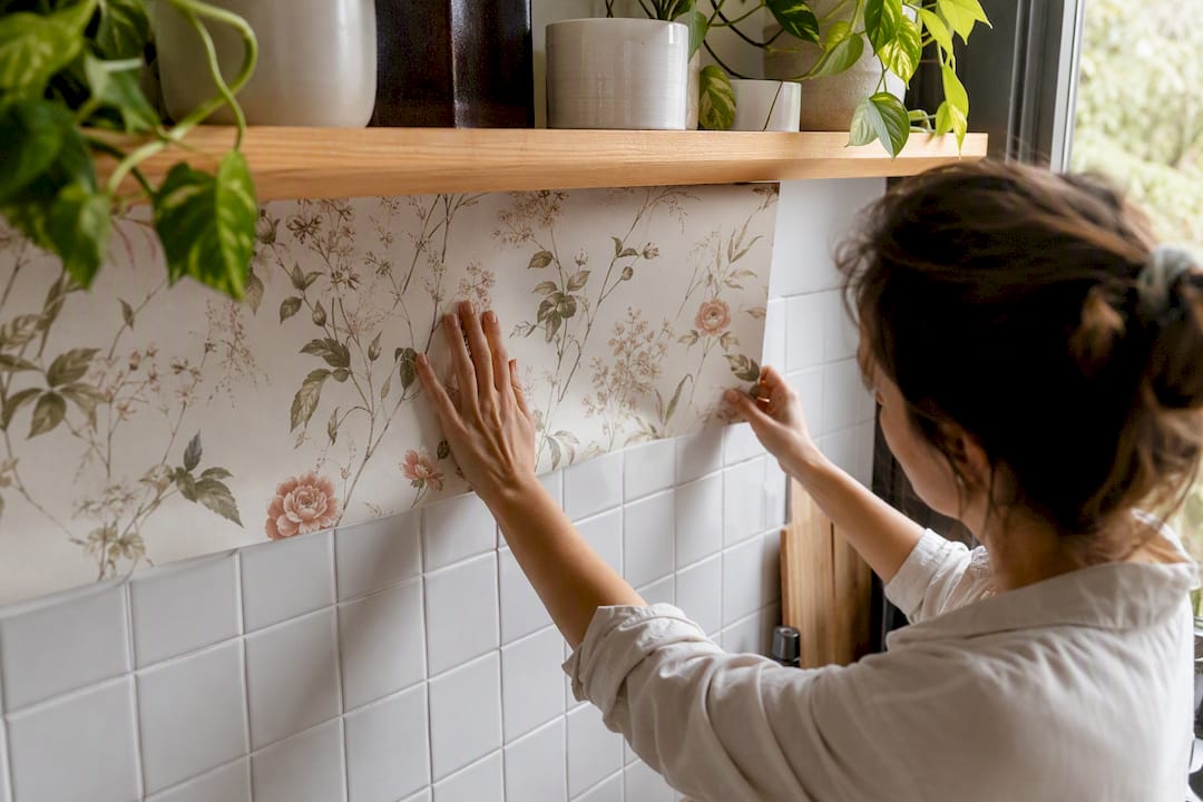 Peel-and-stick wallpaper on tiled wall