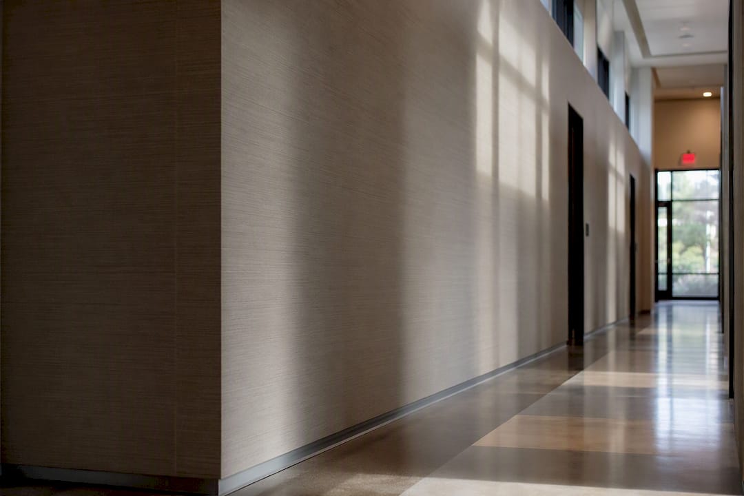 Commercial hallway with fire rated wallpaper on walls