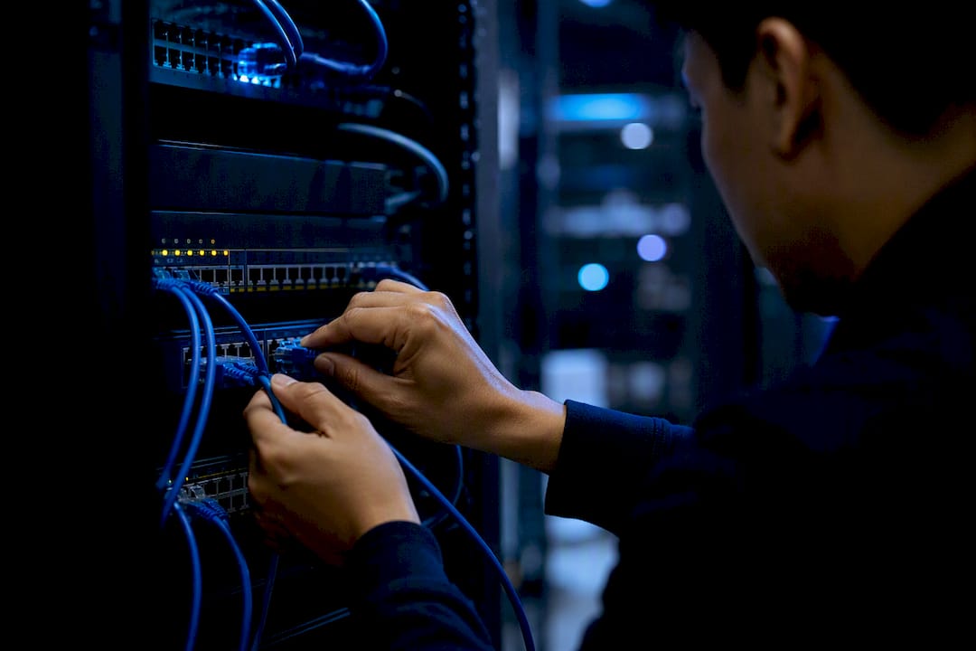 Hands wiring network device during failure drill