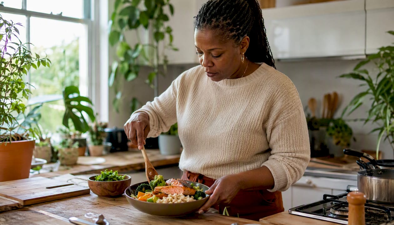 Woman preparing protein-focused meal at dining table