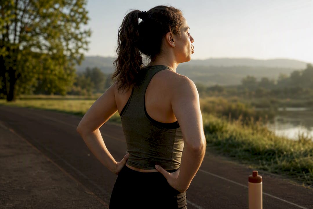 Person practicing pursed-lip breathing outdoors