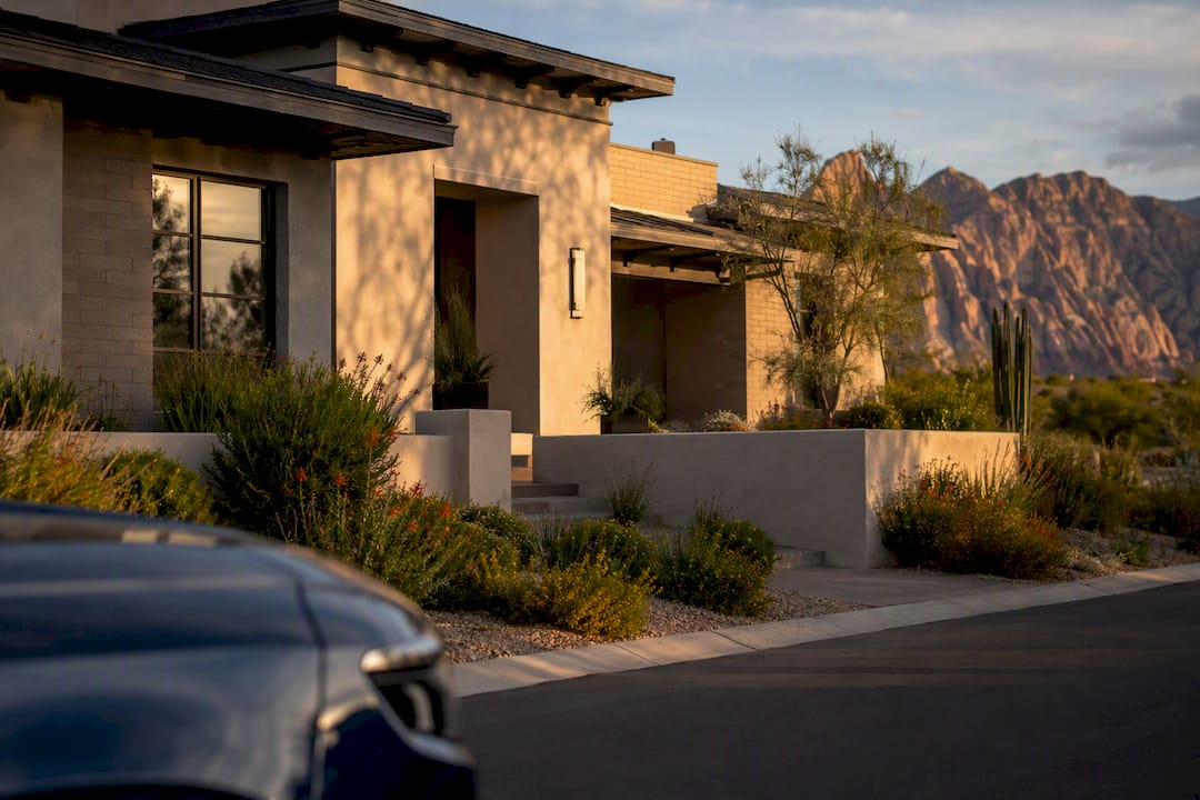 Luxury home exterior with Red Rock Canyon backdrop