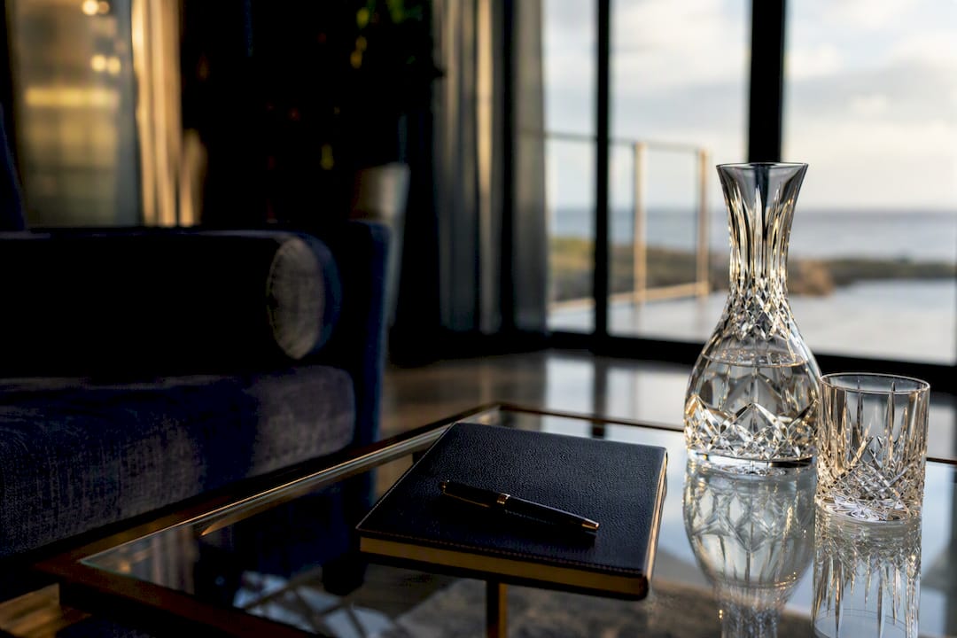 Luxury home side table with notebook and glassware