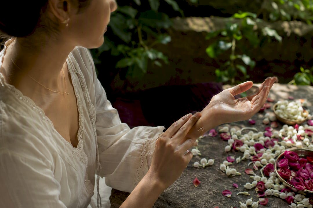 Applying botanical perfume on pulse points