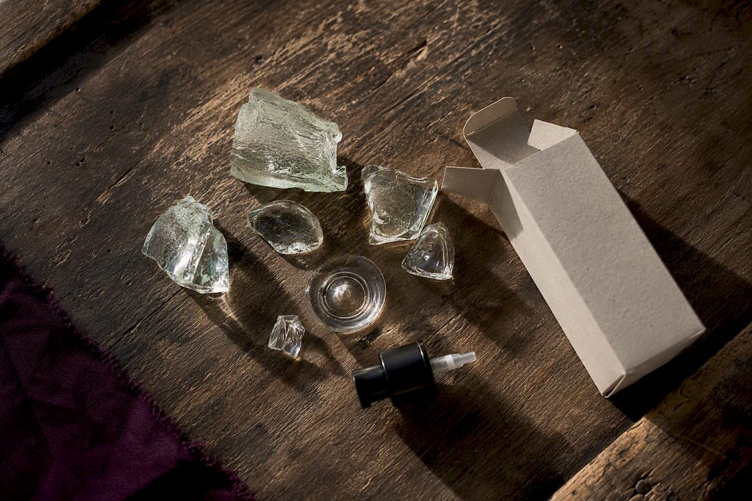 Separated recycled glass and perfume packaging parts