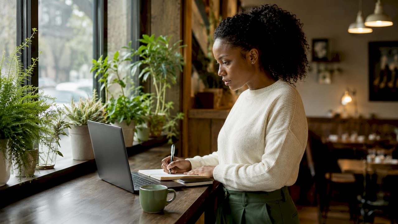 Cybersecurity analyst checking website safety score at desk