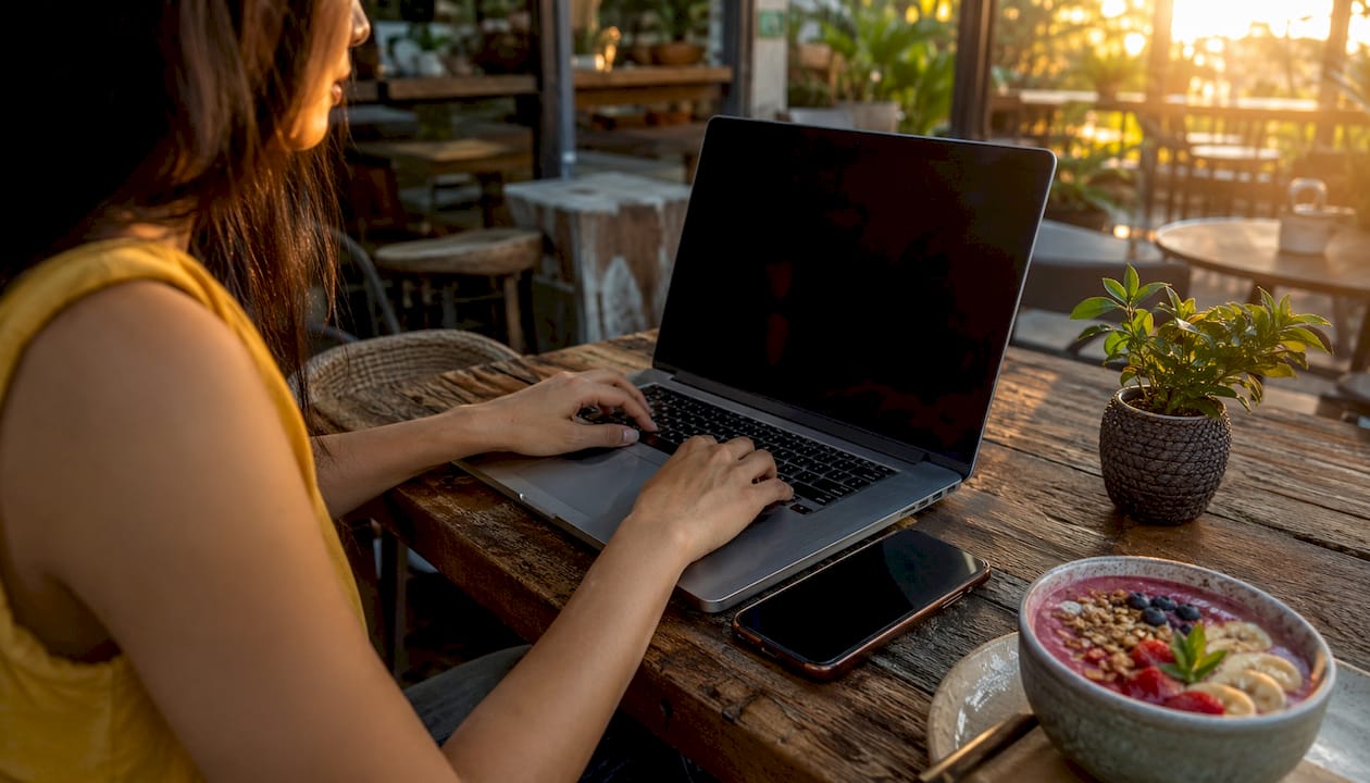 Hands registering sportsbook account on laptop
