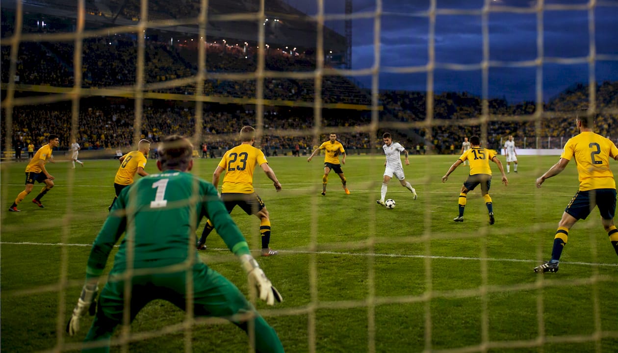 Football tactical match moment under stadium lights
