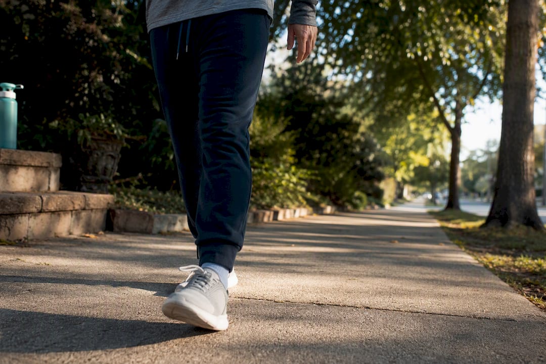Adult taking a short outdoor recovery walk