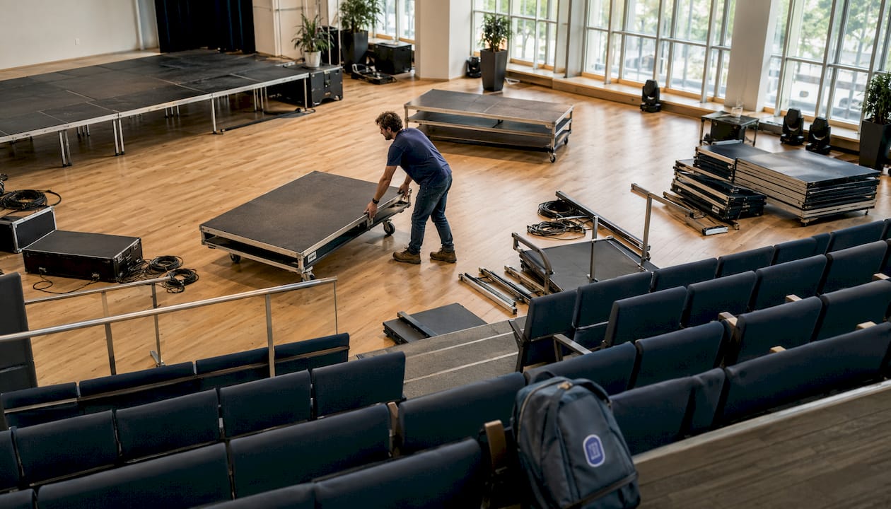Technician adjusting movable stage platform
