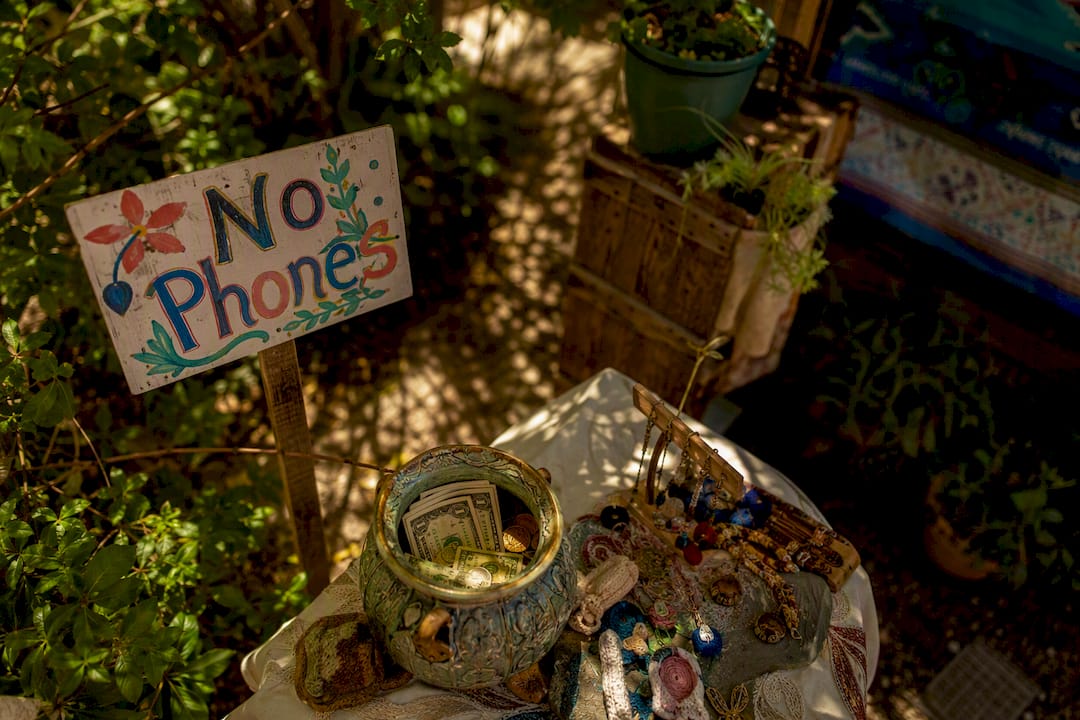 No photography sign and tip jar backstage