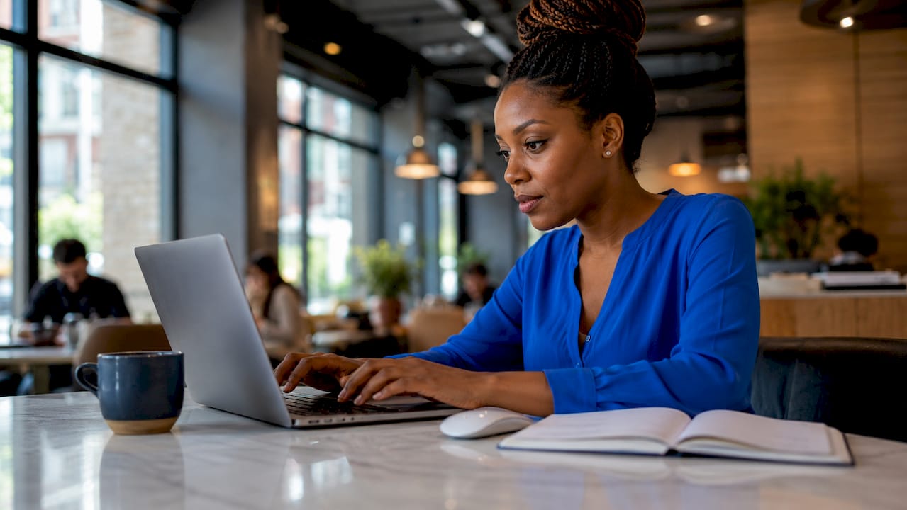 Woman working on AI lead qualification at desk