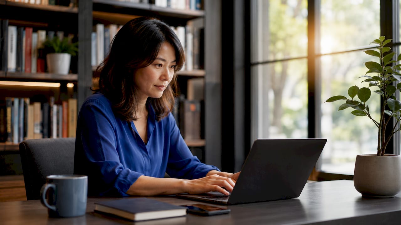 Woman working on AI outreach platform laptop