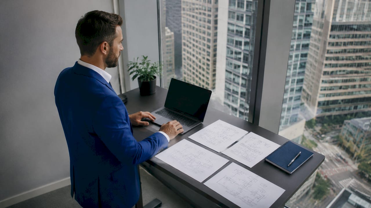 Professional configuring sales AI on laptop