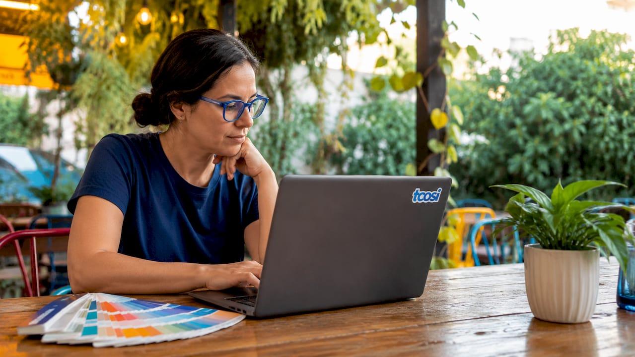 Web designer reviewing color contrast on computer