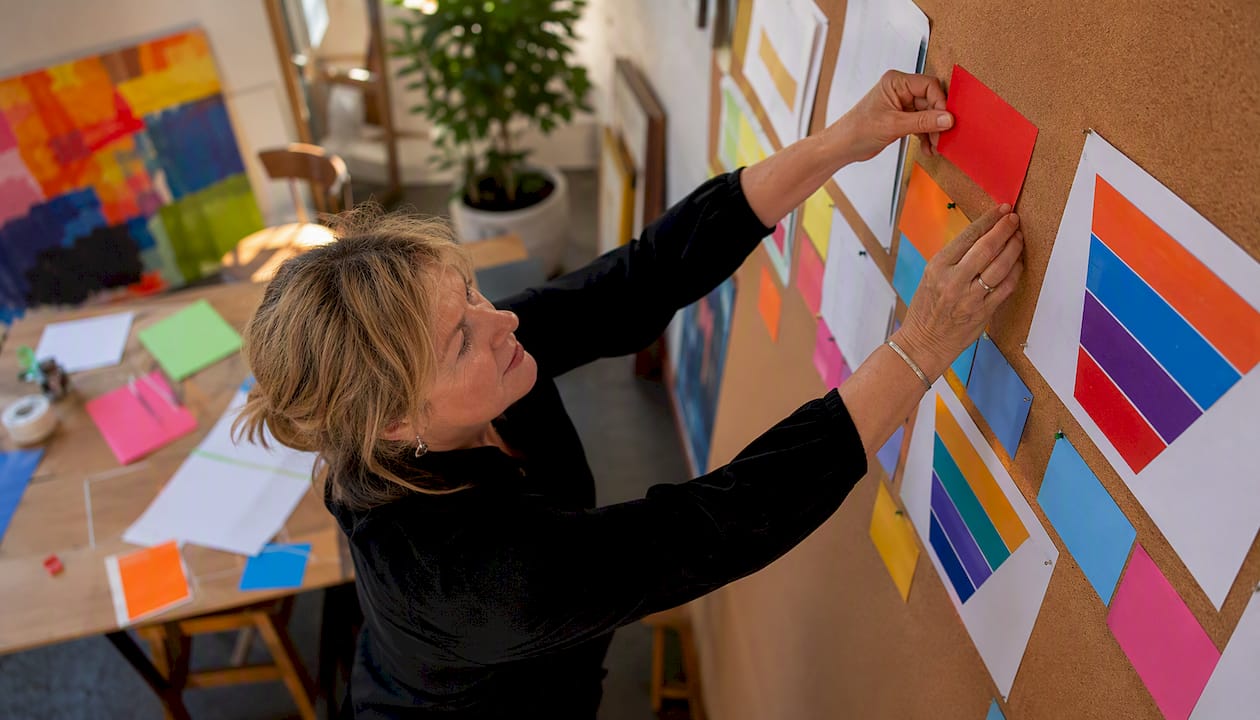 Business owner arranging marketing funnel sticky notes