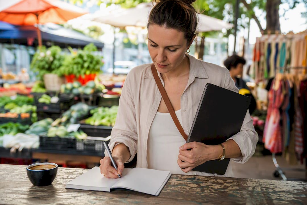 Woman sketching ad campaign outdoors