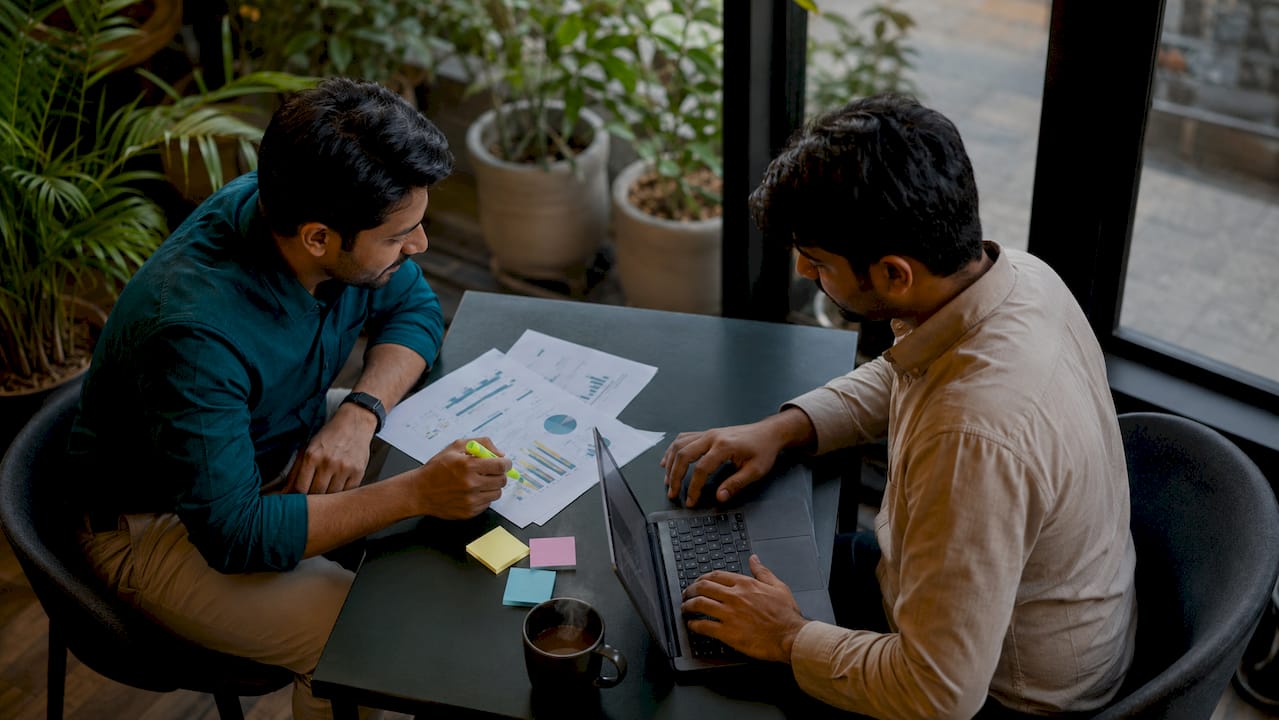 Colleagues discussing salary benchmark data