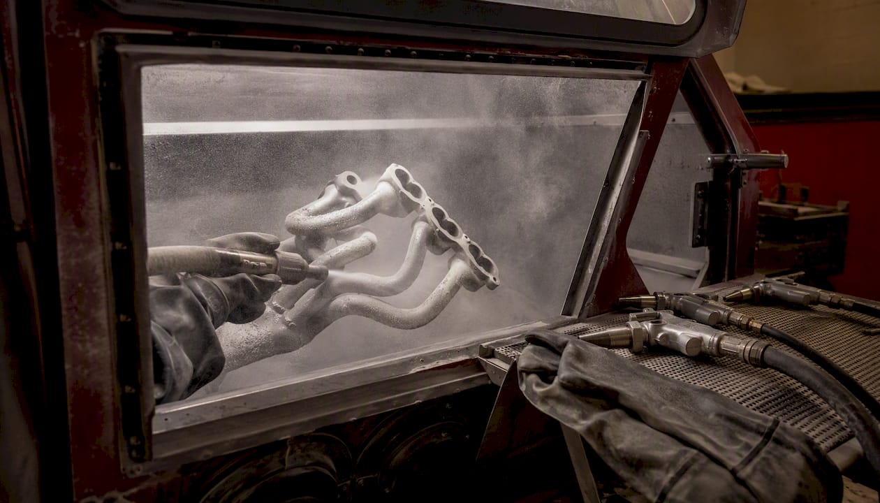 Headers inside media blasting cabinet for prep