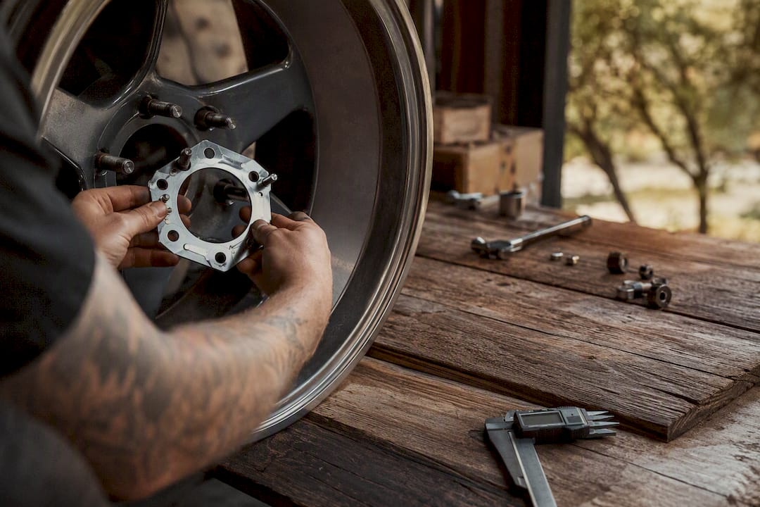 Manual measuring tools on wheel lug holes