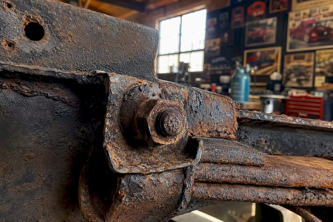 Corroded truck suspension bolt close-up