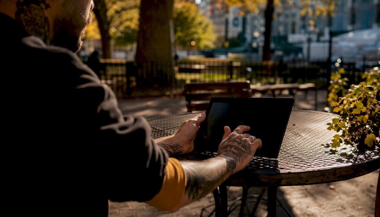 Indie artist selecting streaming service on tablet