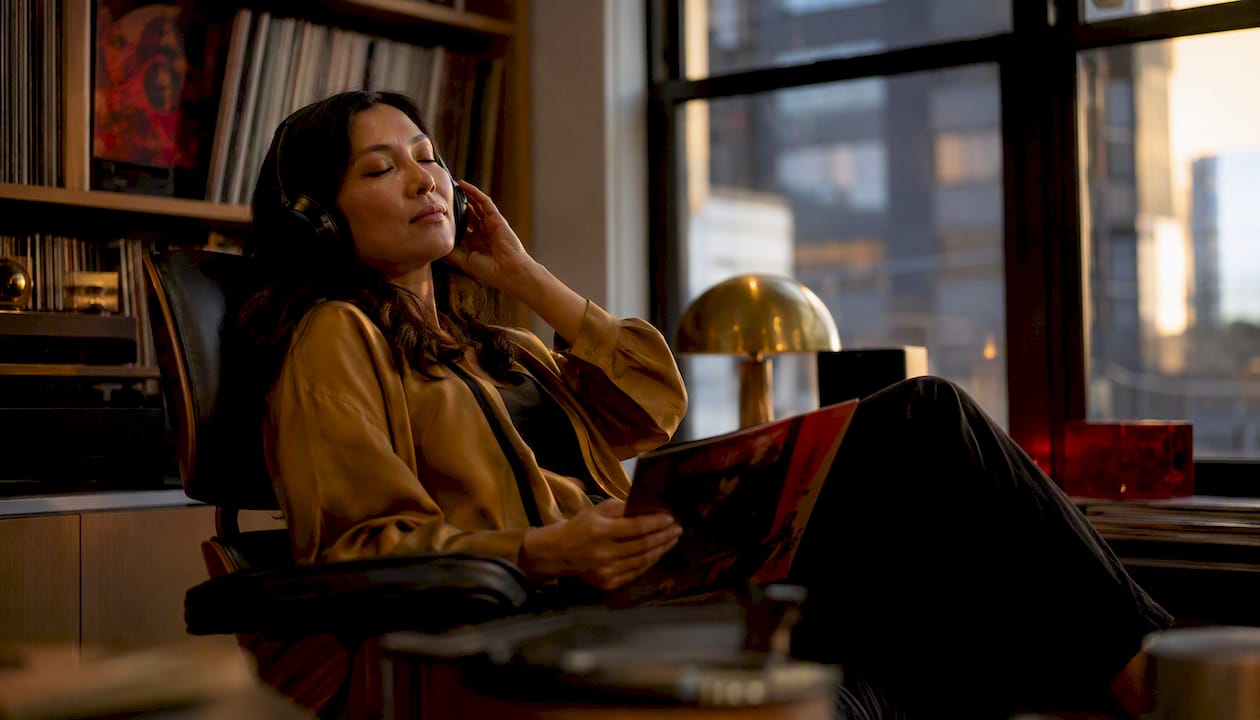 Woman listening to nostalgic vinyl record