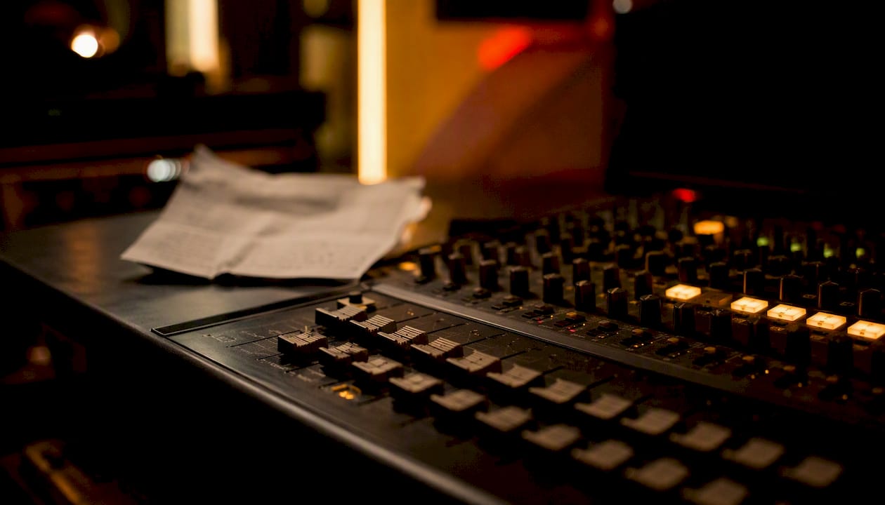 Mixing console with lyric sheet in studio