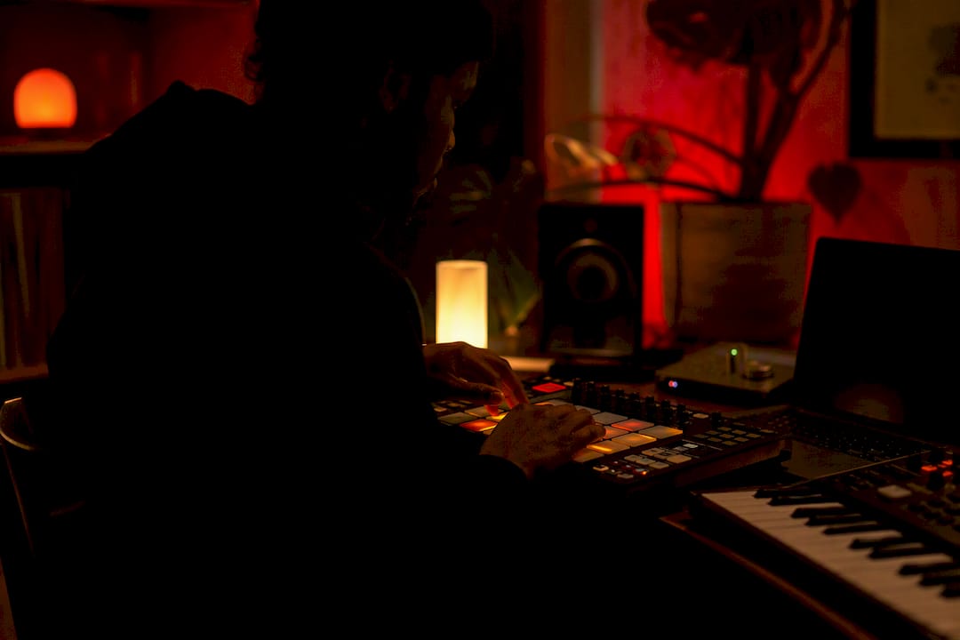 Hands chopping samples on MIDI pads