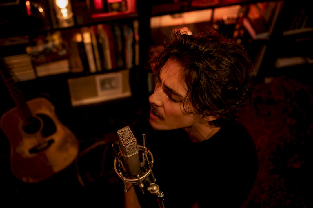 Singer recording vocals in studio