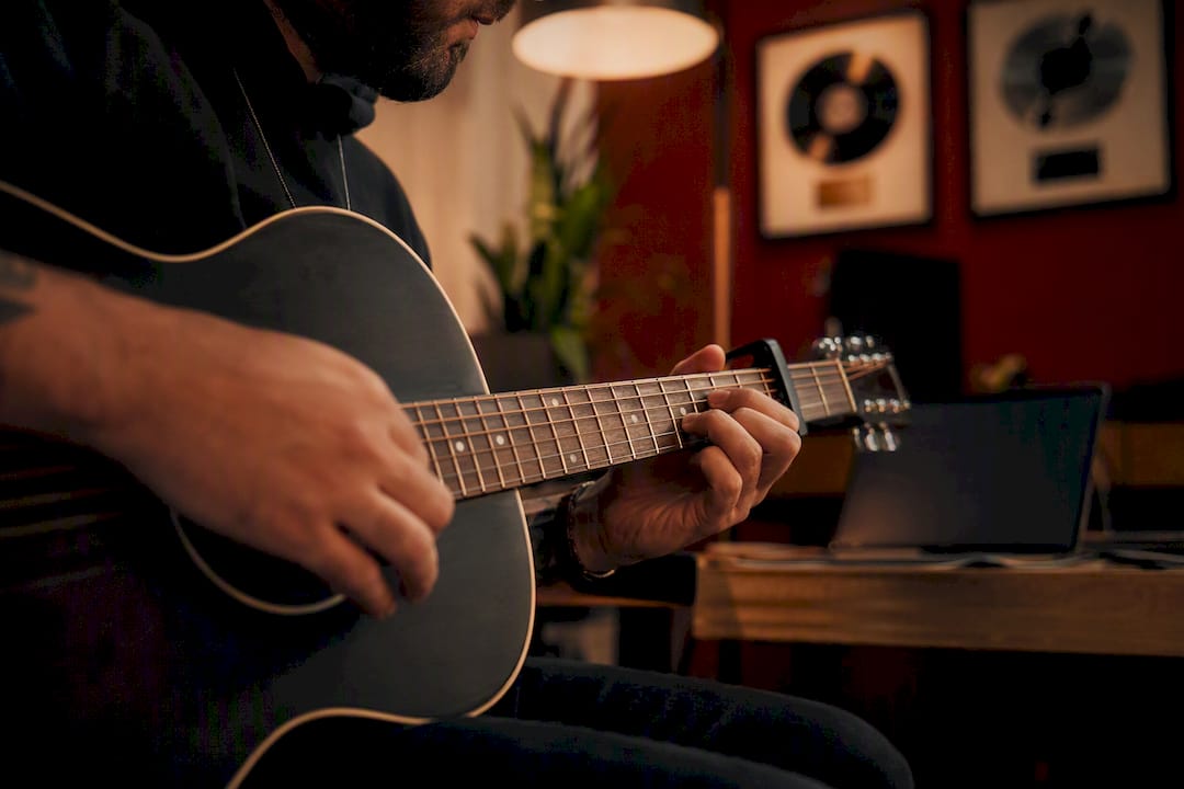 Hands typing songwriter registration details