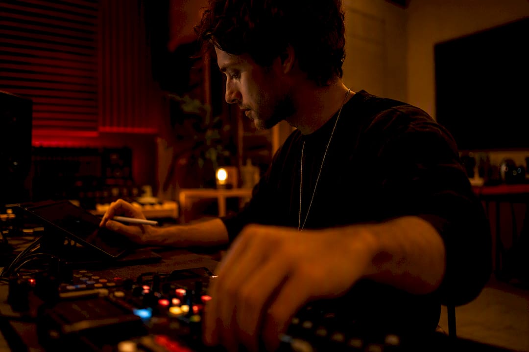 Musician adjusting music visualizer setup in studio
