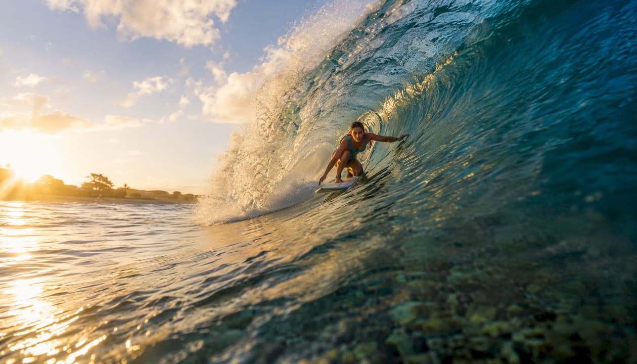Surfer inside barrel of plunging wave