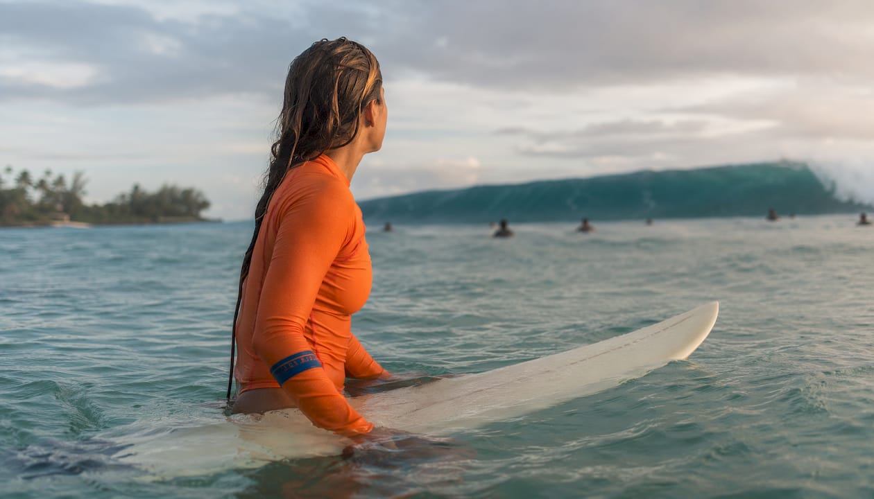 Surfer timing wave takeoff in lineup