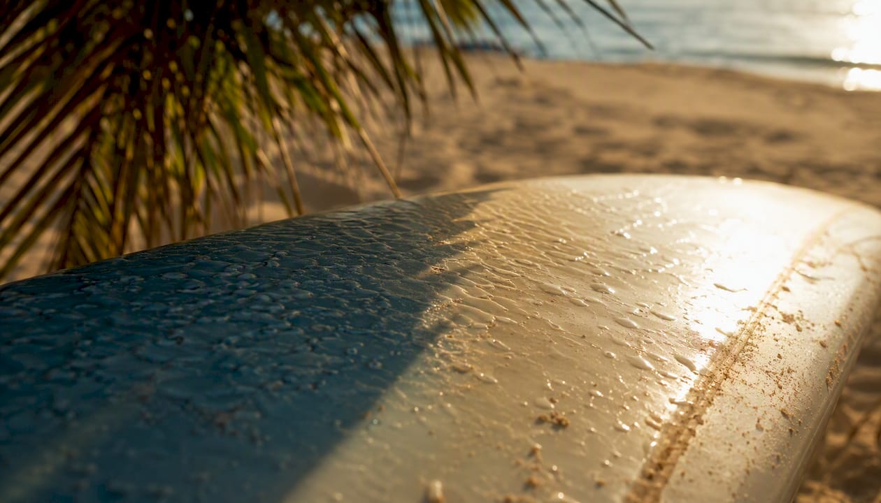 Surf wax melting under sun on board