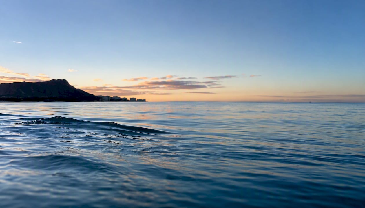 Glassy calm ocean on Hawaiian south shore morning