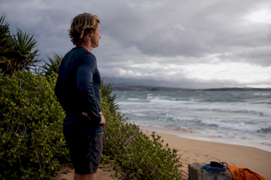 Instructor assessing rough surf conditions