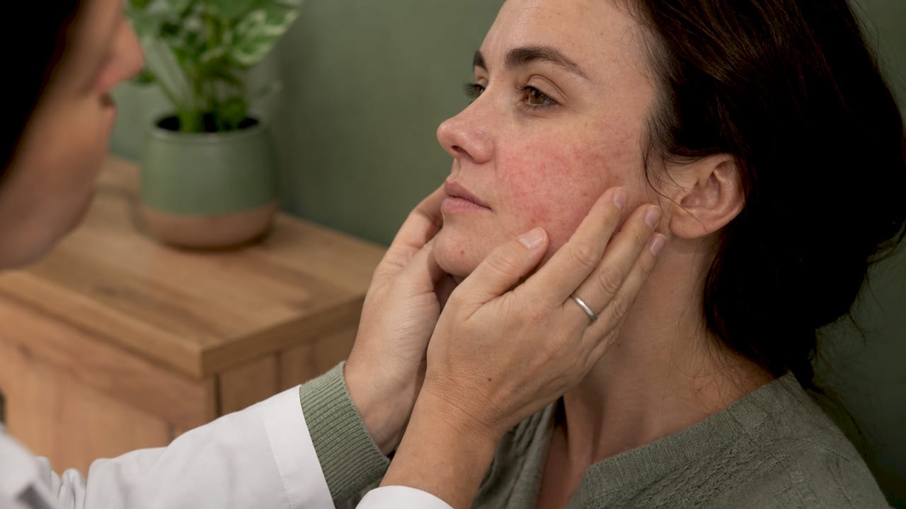 Dermatologist examining sensitive cheek skin