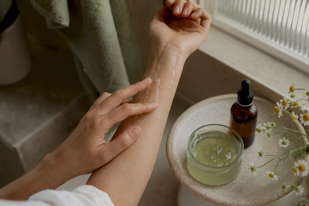 Hands applying aloe gel after vitamin C serum