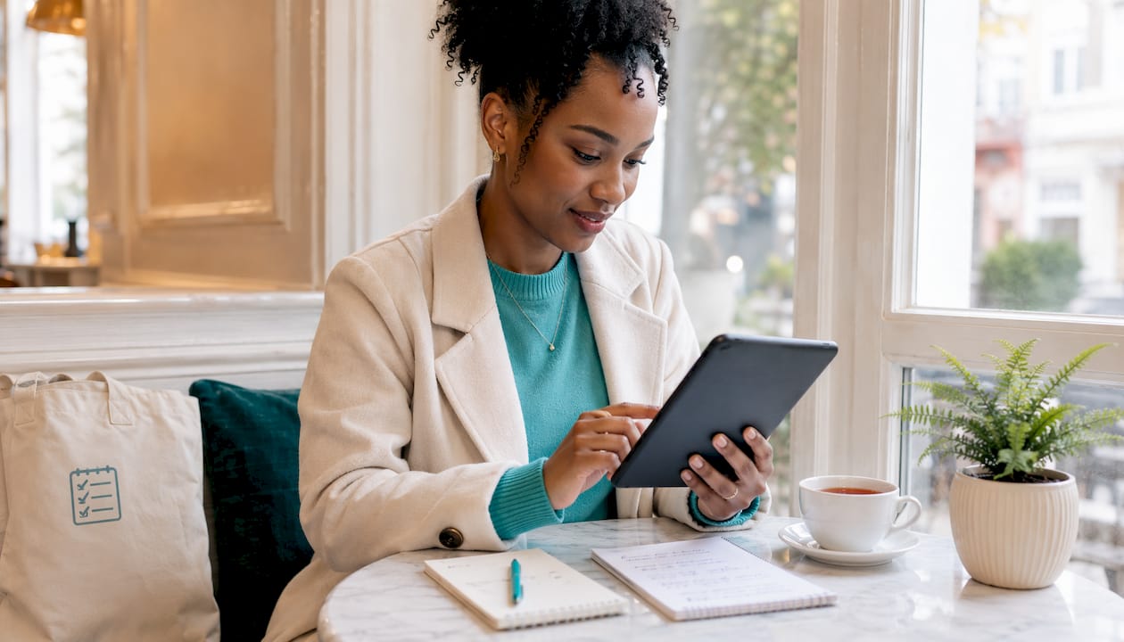 Woman using gift draw app at kitchen table