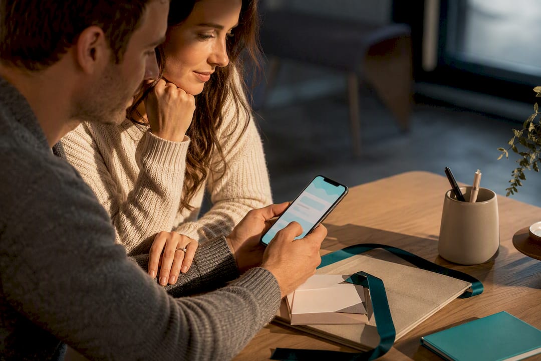 Couple reviewing polite wedding gift wording
