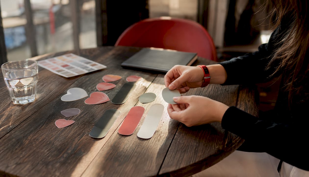 Close-up of assorted promotional stickers on table
