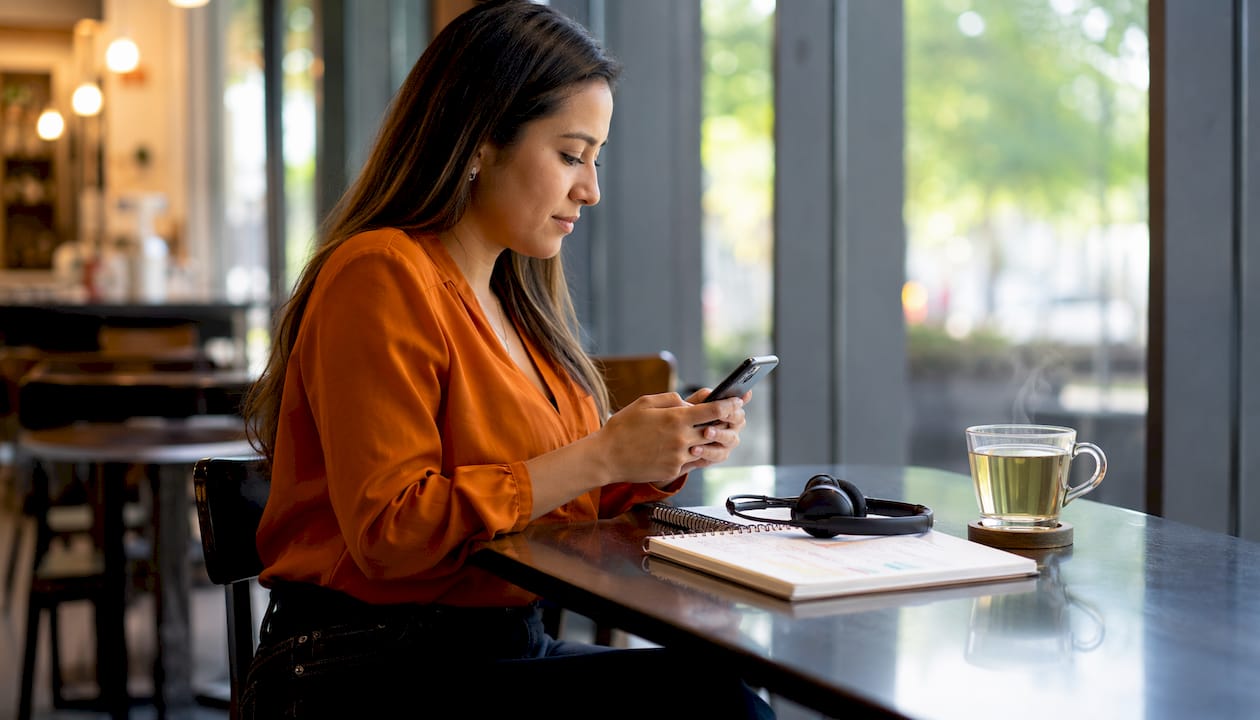 Hands configuring phone call routing on smartphone