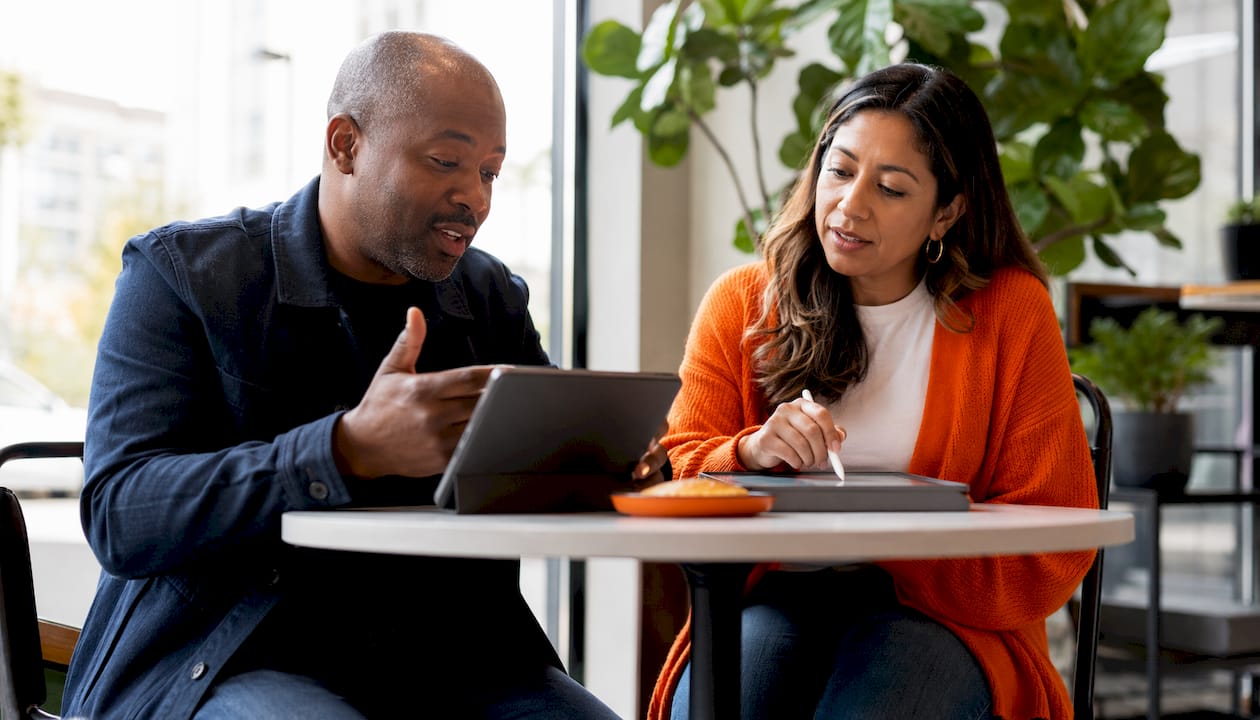 Two colleagues discussing phone solution setup
