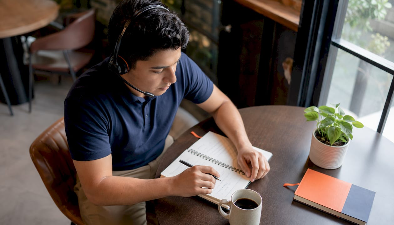 Call center agent reviewing call logs at desk