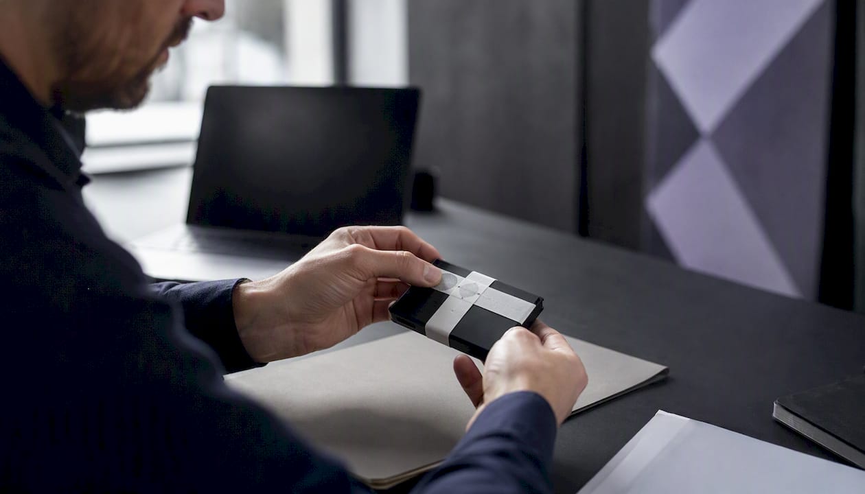 Hands sealing audit token