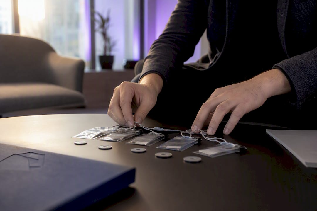 Hands organizing AI model inventory evidence packs
