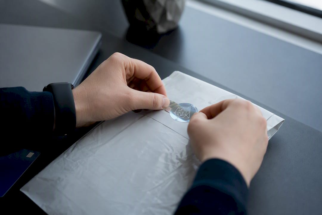 Hands sealing cryptographic evidence pack
