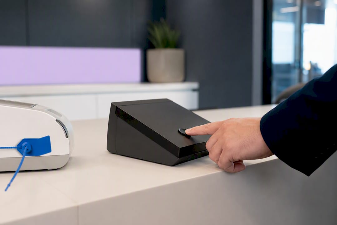 Hand pressing control button in financial office