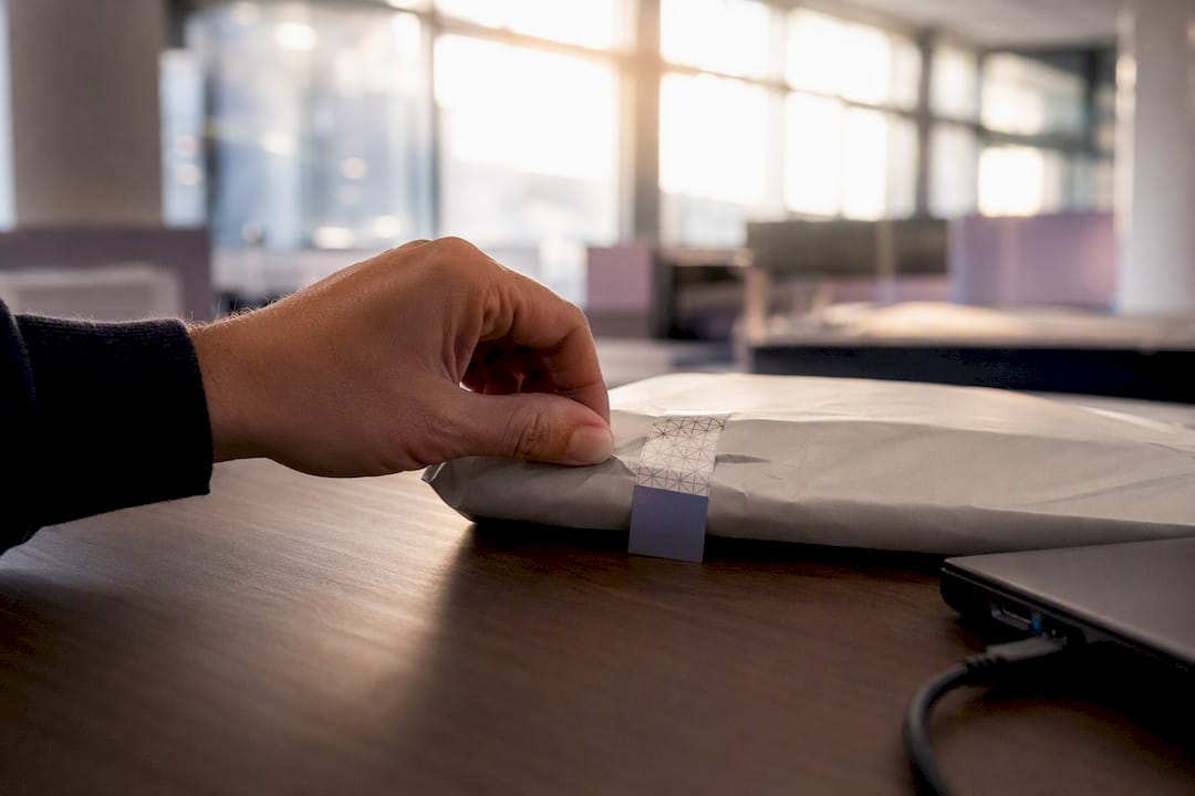 Hand applying cryptographic seal to evidence pack